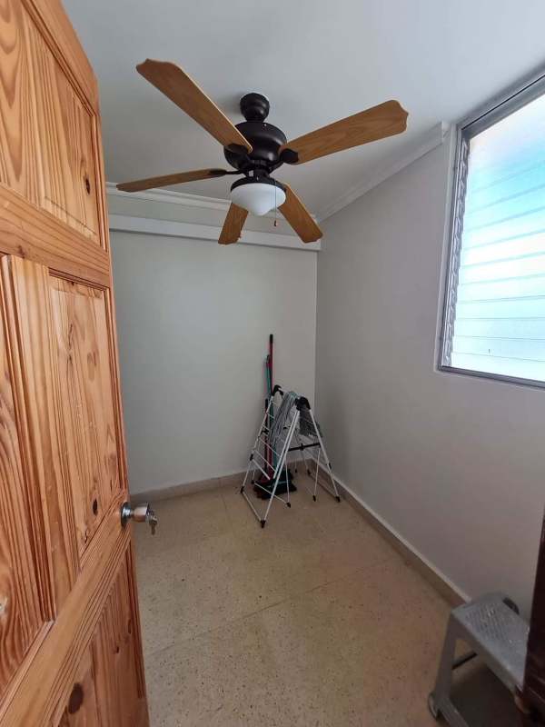 Practical storage room with fan, ladder and window in PH Neptuno Panama City