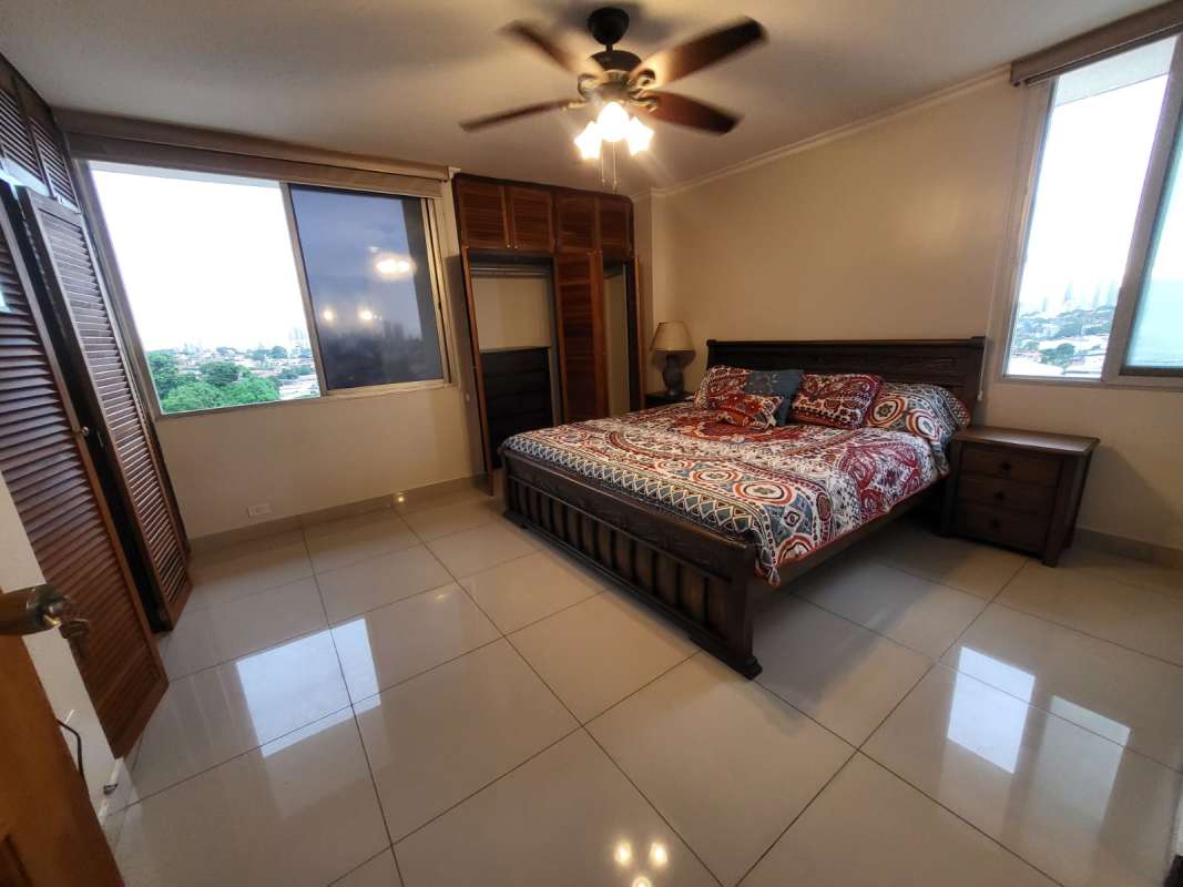 Spacious main bedroom with large windows, closet, AC and fan PH Neptuno Panama