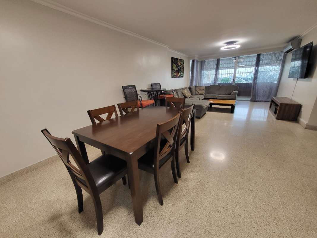 Corridor leading to bedrooms with wood closets in PH Neptuno apartment Panama City
