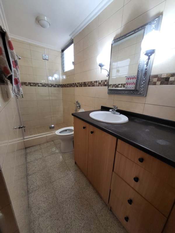 Modern bathroom with glass shower, mosaic tile, wood vanity in PH Neptuno Panama