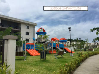 Kids playground with slides and greenery at River Valley Panama
