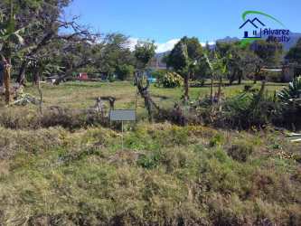 Fenced grassy plot of land with mountain backdrop in Volcán Chiriquí Panama