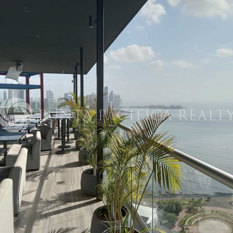 Open-plan living dining space with balcony access at The Sands Avenida Balboa