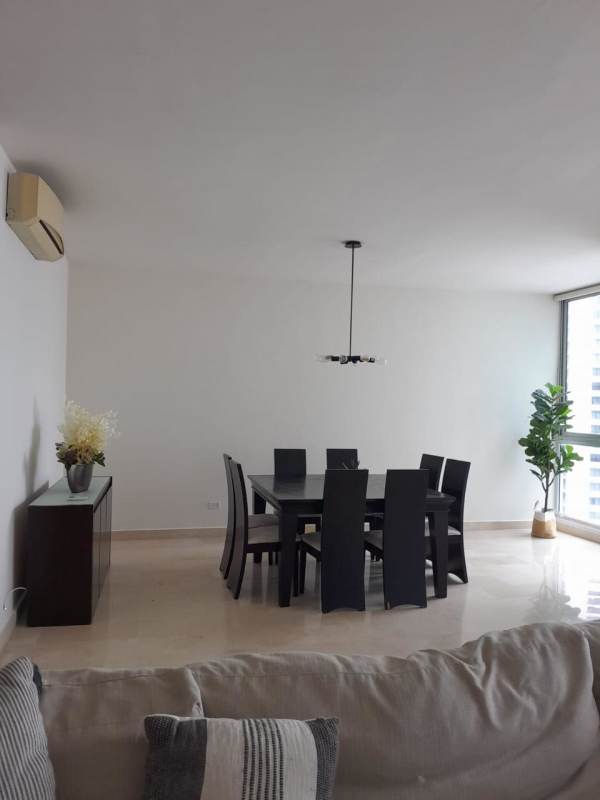 Spacious kitchen with granite countertops and stainless appliances in high-rise Marbella building