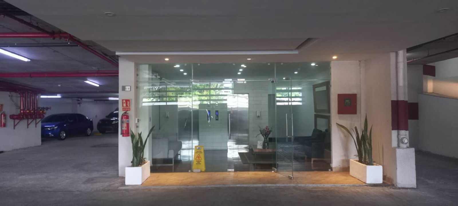Glass door entrance and lobby with elevators PH Midtown Panama City