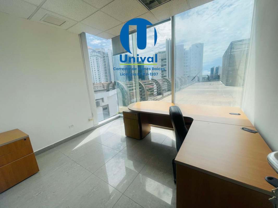 Bright office area with large windows and skyline views in Torre Global Bank
