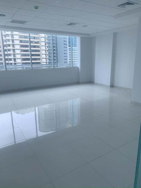 Bright open-plan empty office with floor-to-ceiling windows overlooking Panama City in Punta Paitilla