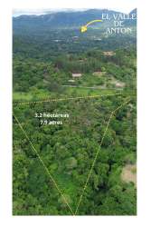 Aerial shot of estate land surrounded by forest and mountains near El Valle Panama