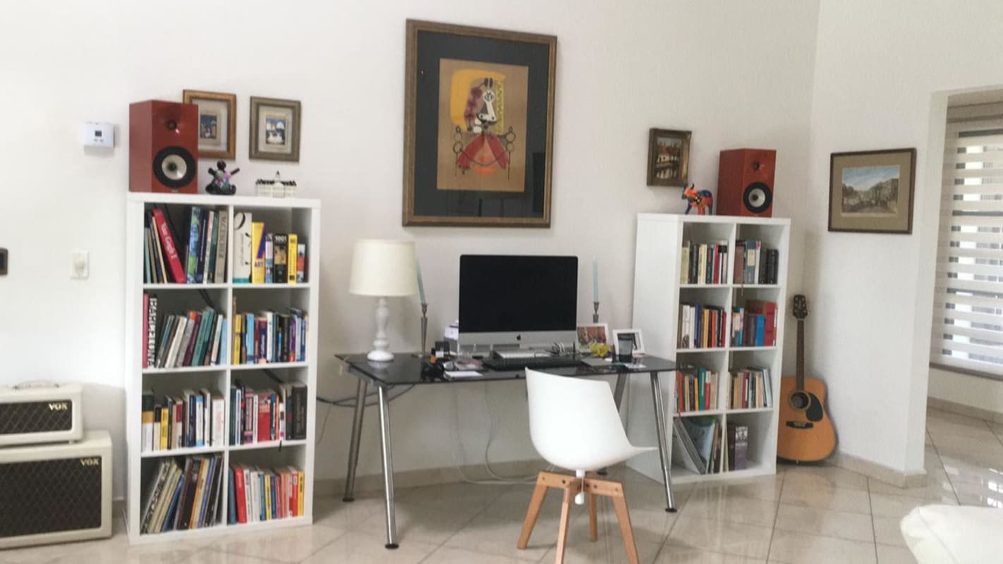 Spacious living room with garden view white sofas in Cardenas Panama home for sale