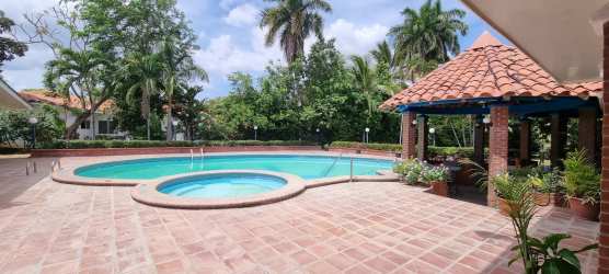 Lush tropical garden with mature trees and manicured lawn Coronado Panama villa for sale