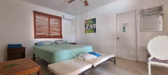 Living room with large sofas windows and open plan design in beach villa Panama