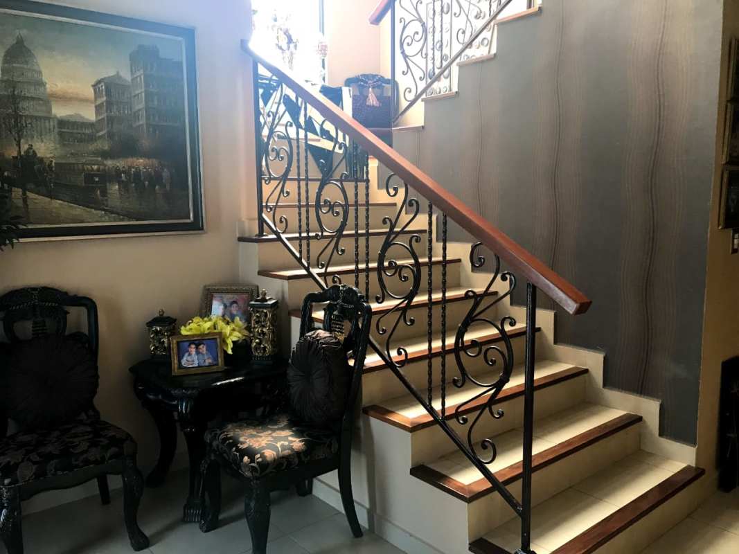 Modern living and dining room in two-story Costa Sur home for sale in El Doral Panama City