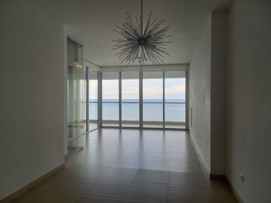 Minimalist open living-dining area with balcony access and Pacific Ocean views PH BICSA Avenue Balboa Panama