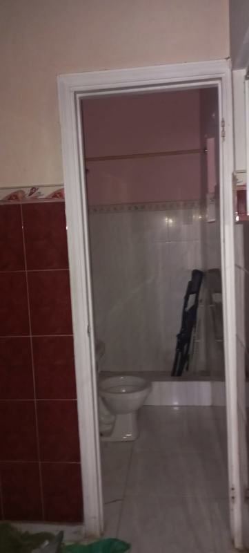 Bedroom with split AC, tile floor, curtains and ceiling fan in Fuente del Fresno Panama