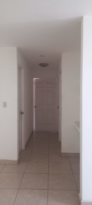 Minimalist hallway with white walls and tiled flooring at PH Splendor By The Park
