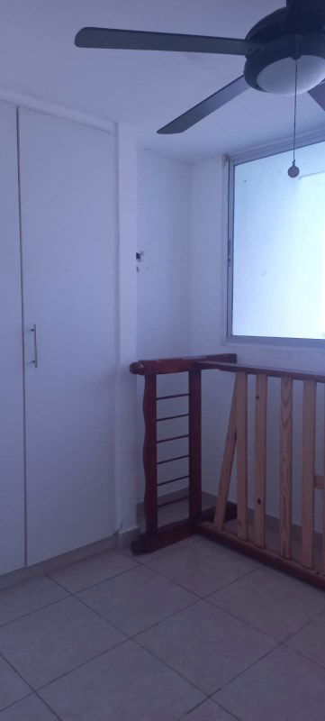 Small landing area with closet space ceiling fan window in Splendor By The Park Panama City