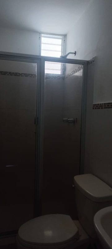 Modern bathroom with tiled walls, glass shower at PH Splendor By The Park Panama City