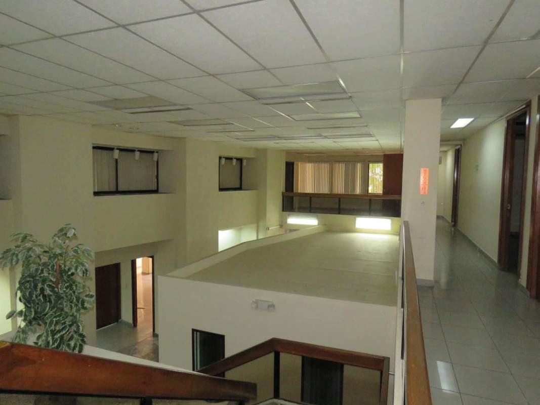 Urban street view of multi-story commercial building near financial district in Panama City Obarrio neighborhood