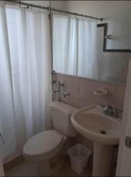 Functional kitchen with granite countertop and wood cabinets in PH Las Olas house for sale Panama