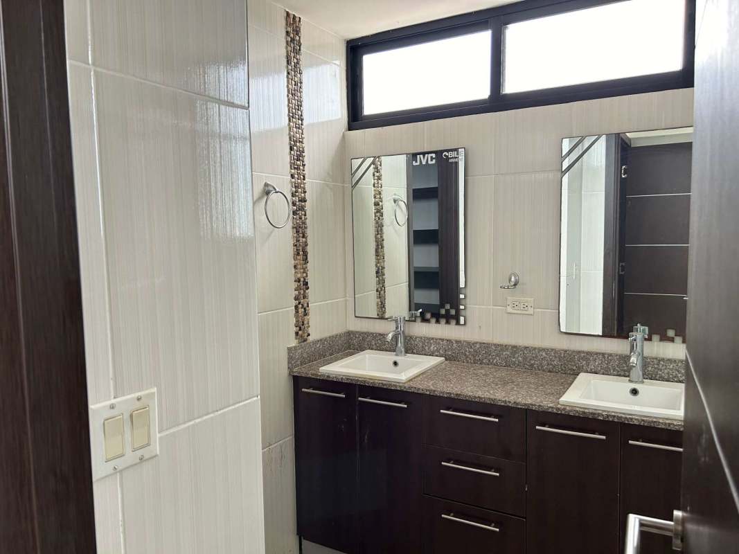 Bathroom with double sink granite vanity mosaic tile and mirrors PH Portofino Tower Bethania Panama