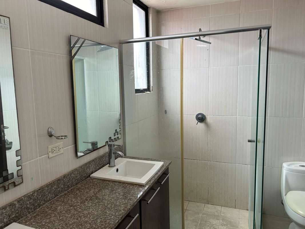 Modern bathroom with glass shower granite vanity large mirror PH Portofino Tower Bethania Panama