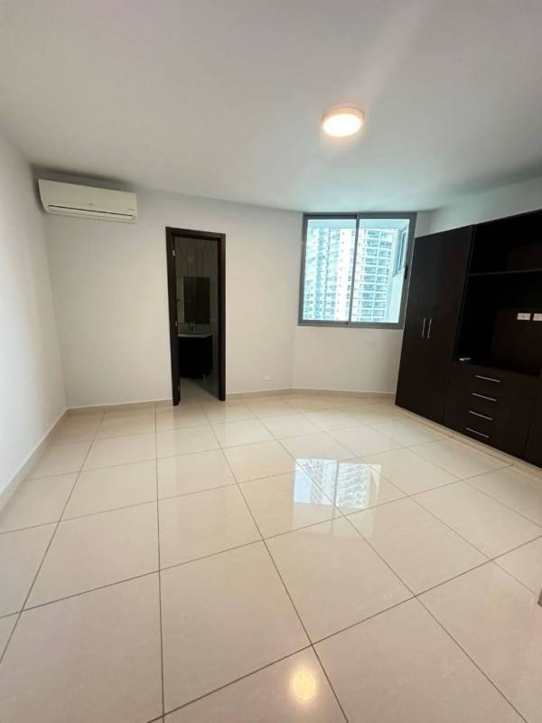 Bright master bedroom with large window, ocean view and walk-in closet in Avenida Balboa luxury PH Allure apartment