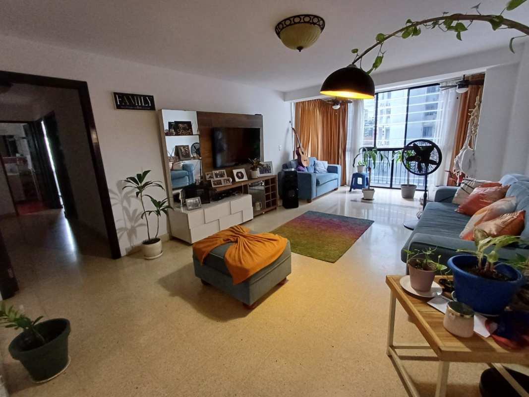 Living room with dining area balcony access PH Avenida Balboa Panama