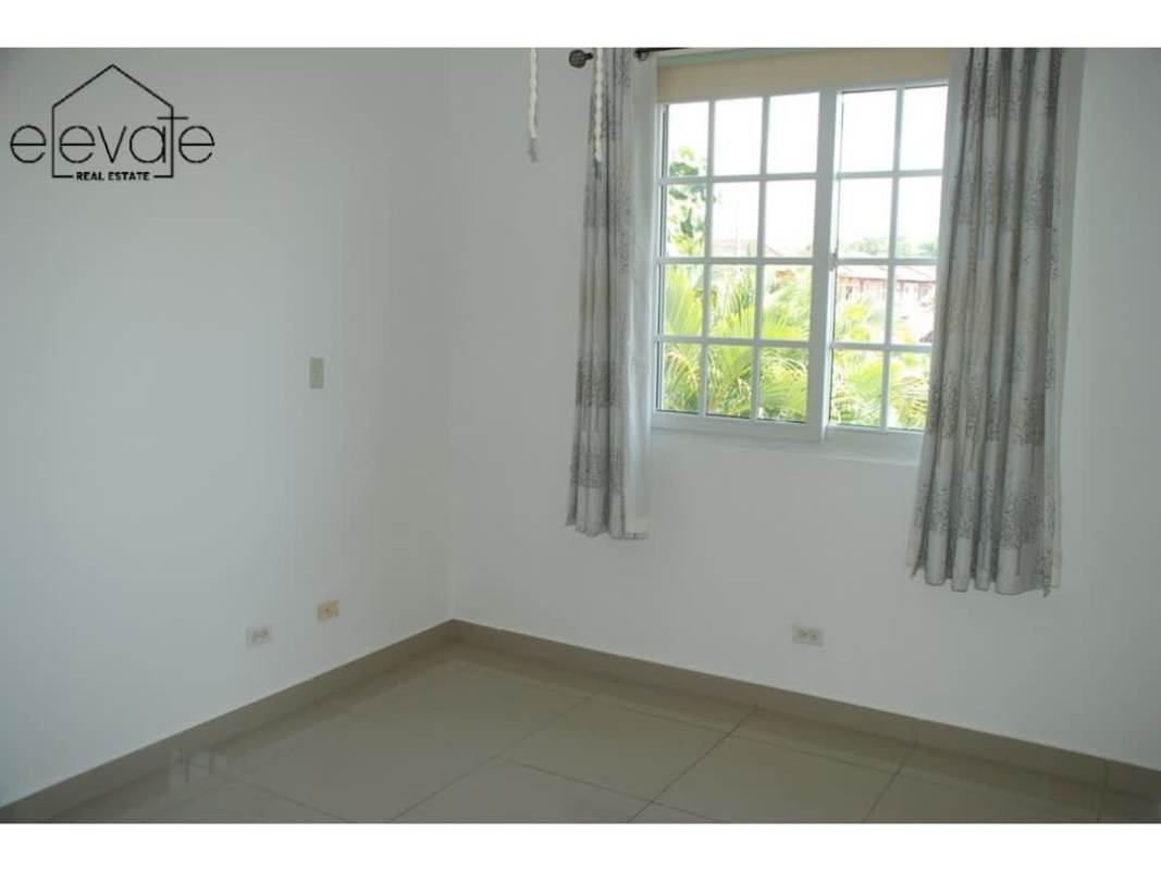 Modern kitchen with granite countertops, island, and stainless appliances in Villa Valencia Panama