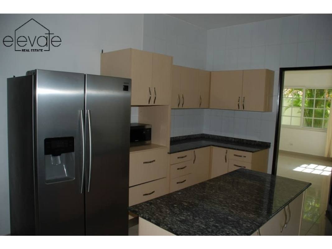 Resort-style swimming pool with deck chairs and gardens Villa Valencia Costa Sur Panama