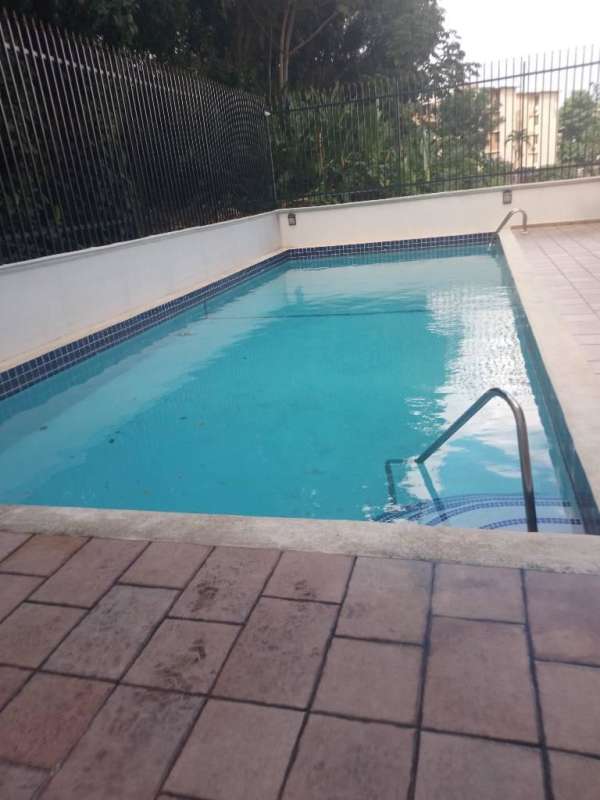 Kitchen with granite counter, wooden cabinets and stainless refrigerator PH La Cresta Panama