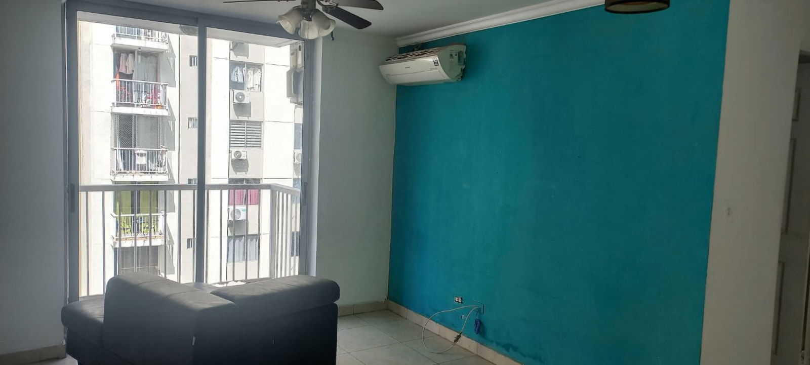 Fenced outdoor swimming pool with lounge chairs in Mystic Tower Panama