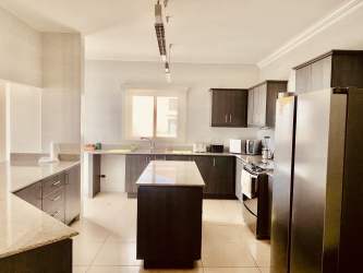 Spacious master bedroom with balcony and Pacific ocean views in Olas 2 Panama