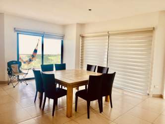 Balcony overlooking Pacific ocean and golf course in Vista Mar Panama