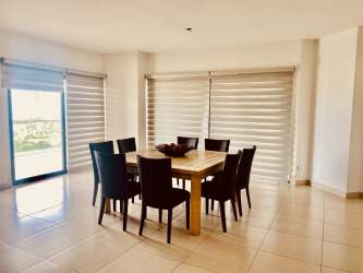 Modern kitchen with granite island and stainless appliances in Olas 2 Vista Mar Panama