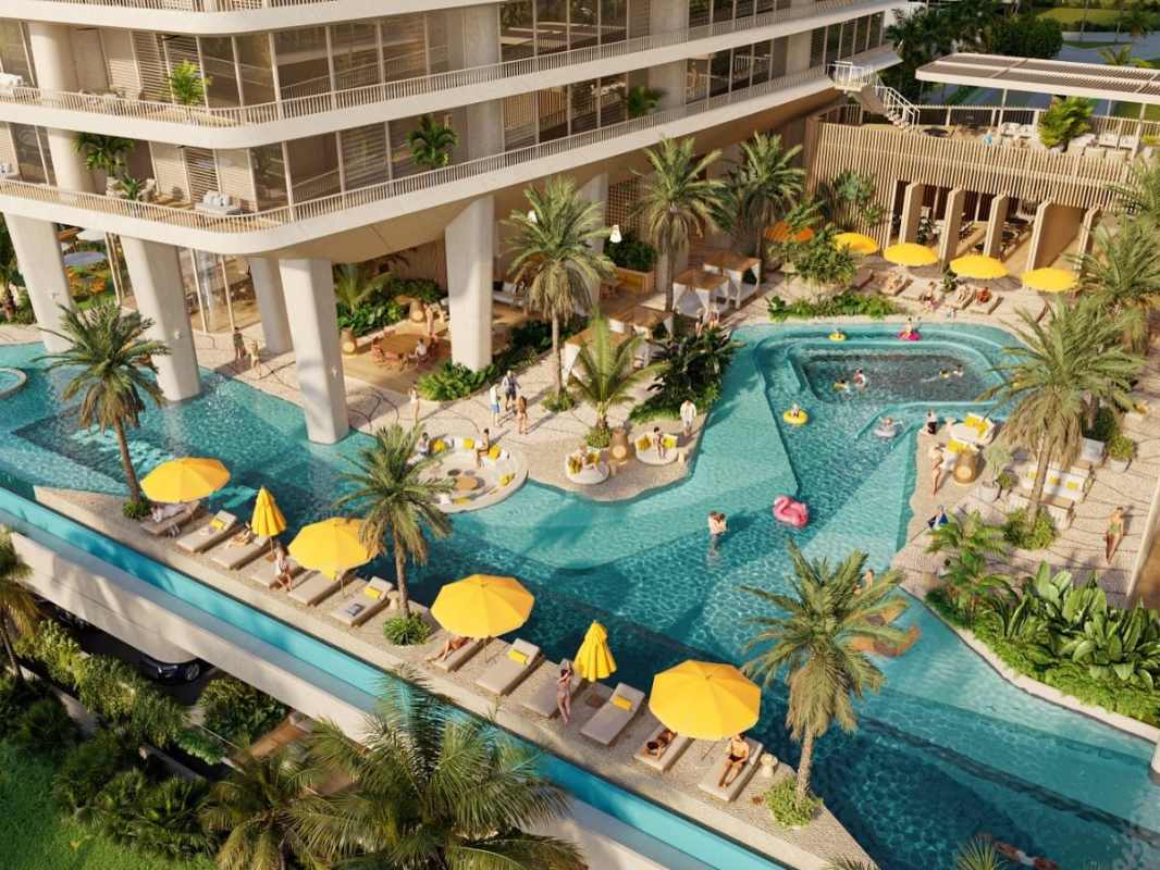 Resort-style pool zone with palm trees and twin high-rise towers at IPANEMA