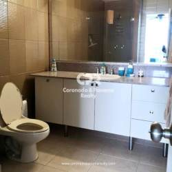 Modern bathroom with large mirror floating vanity at PH Coronado Bay