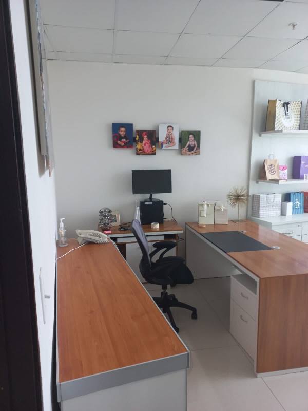 Office interior with conference table and city views in Revolution Tower Panama City