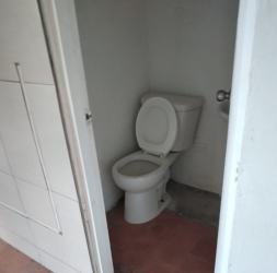 Basic small bathroom for commercial property with toilet Santiago Panama