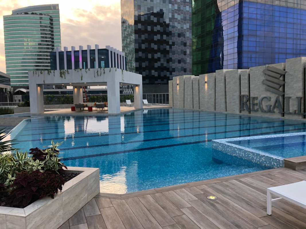 Luxurious rooftop infinity pool with cabana seating overlooking Panama skyline at PH Regalia Costa del Este