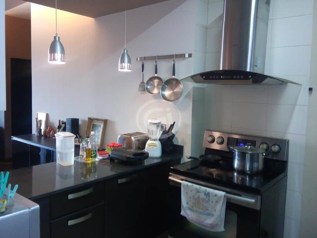 Contemporary kitchen with granite countertops and stainless appliances in PH San Francisco Sky Panama