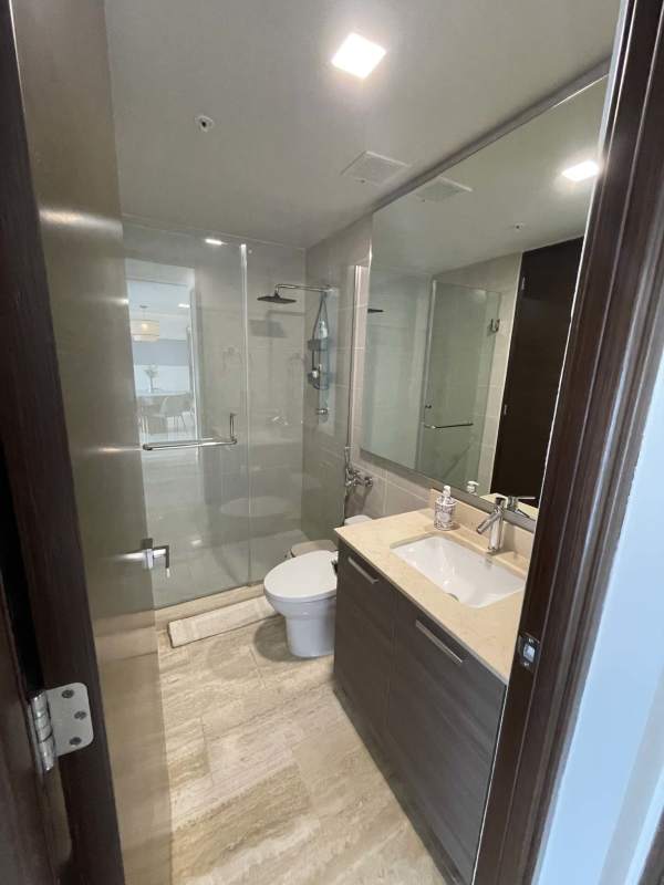 Contemporary bathroom with glass enclosed shower and modern fixtures Costa del Este apartment Panama