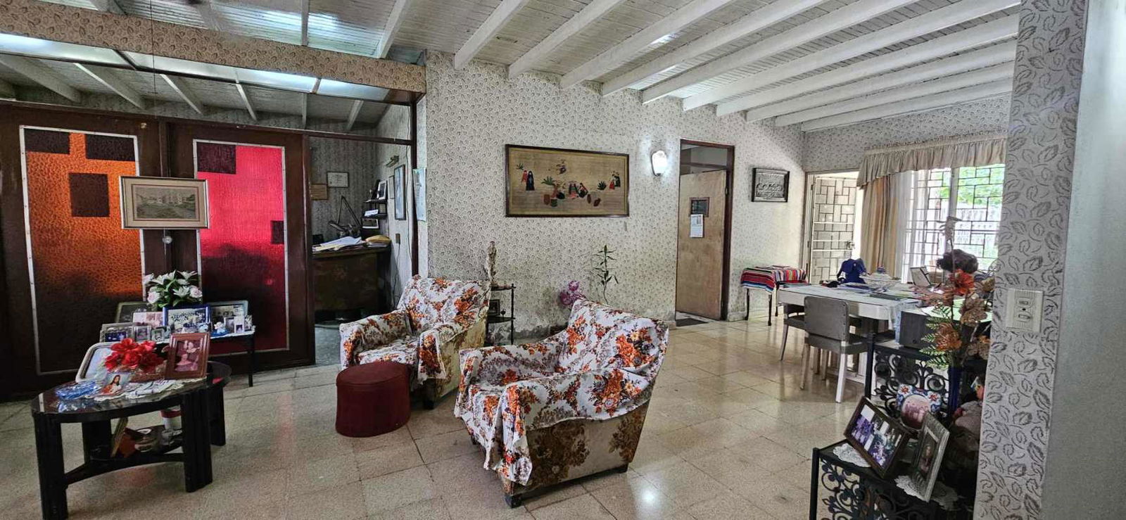 Vintage kitchen with teal cabinets round dining table large window Carrasquilla Panama