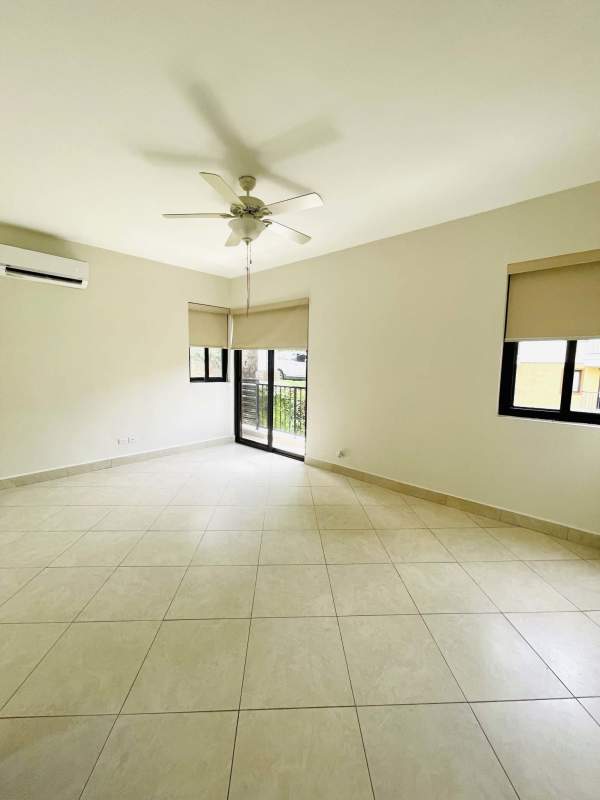 Covered balcony with green garden views luxury rental Embassy Club Panama