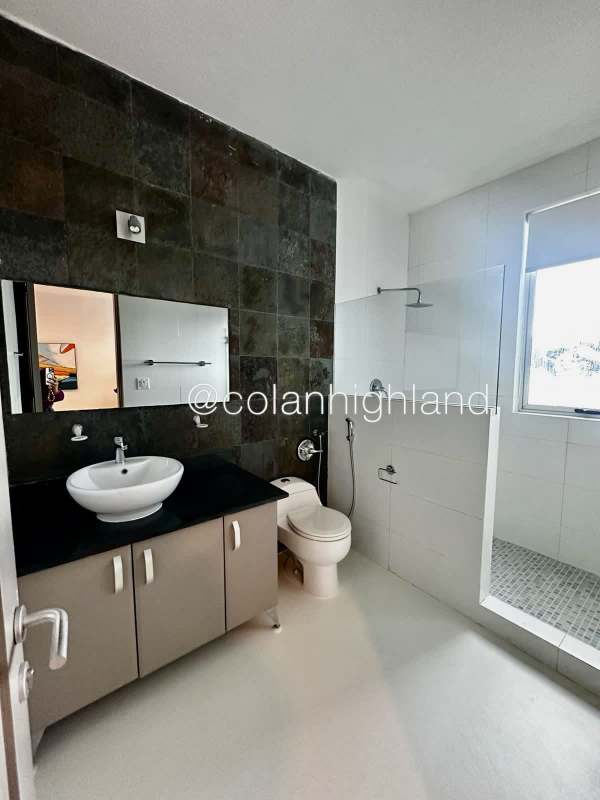 Contemporary bathroom with glass walk-in shower double sink in luxury PH Q Tower Panama