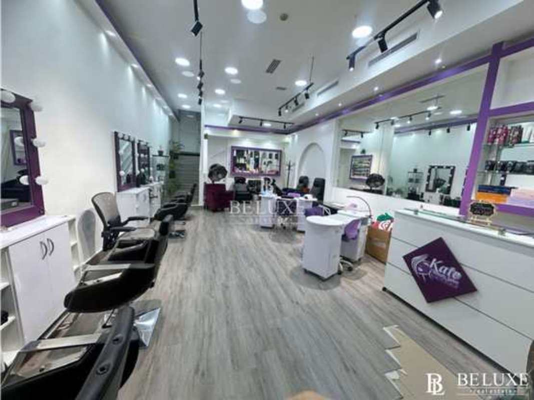 Full-service salon with mirrors, styling stations and modern furnishings in Plaza 68 San Francisco