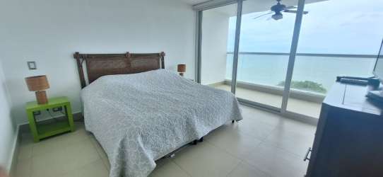 Spacious living and dining room with sliding doors to oceanfront balcony Bahia Resort Panama