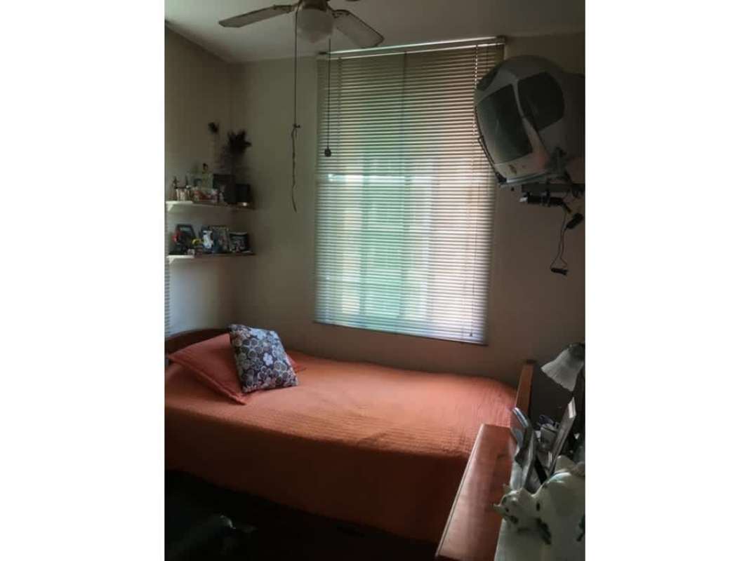 Dining room with mirror wall and marble floors at PH Bahía Esmeralda Marbella Panama