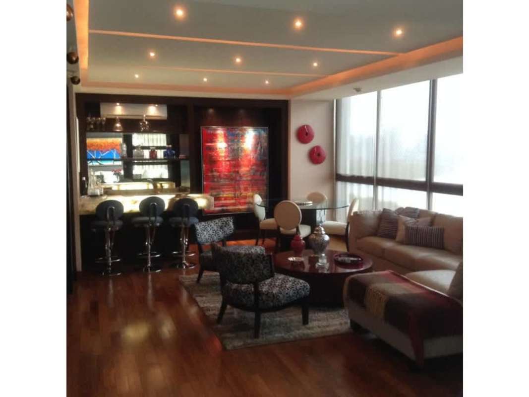 Modern hallway with hardwood floors leading to bedrooms in PH Puntarenas Panama