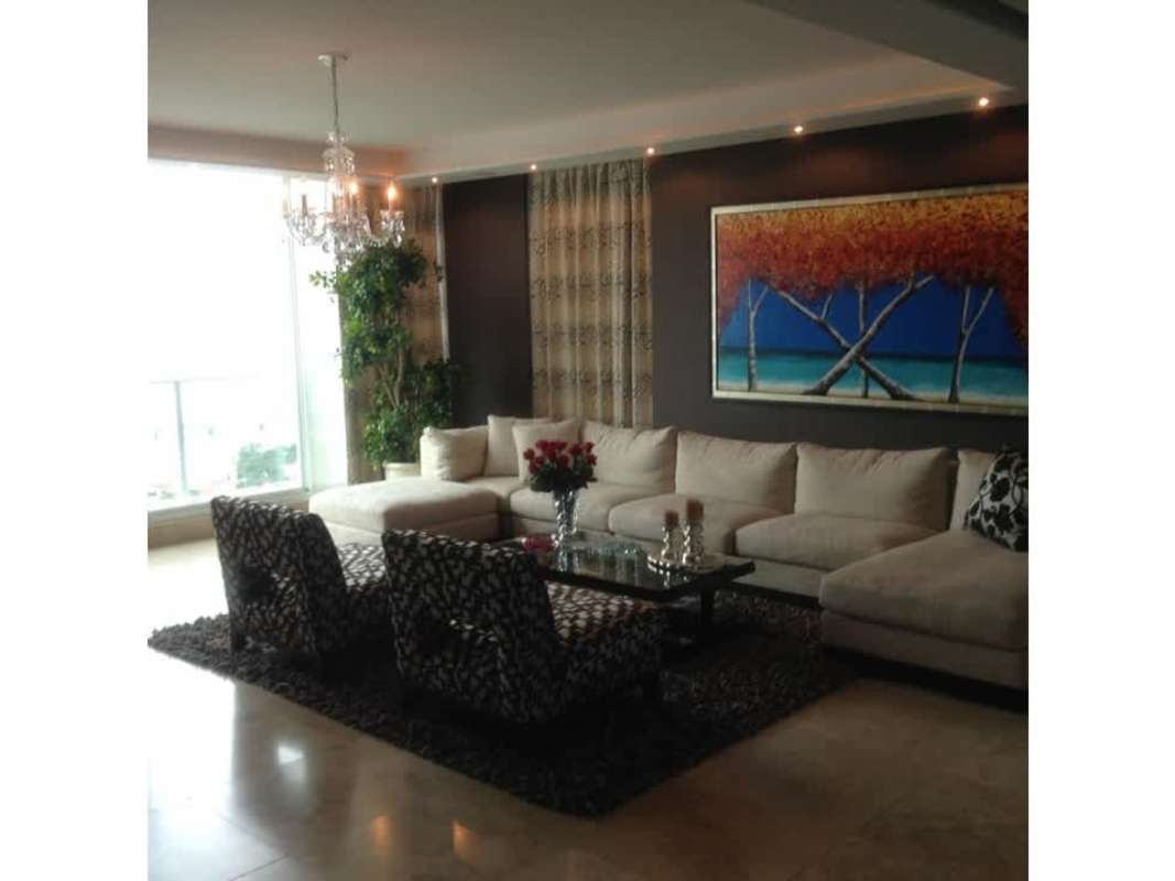 Contemporary open living dining area with access to balcony overlooking ocean in PH Puntarenas Coco del Mar Panama