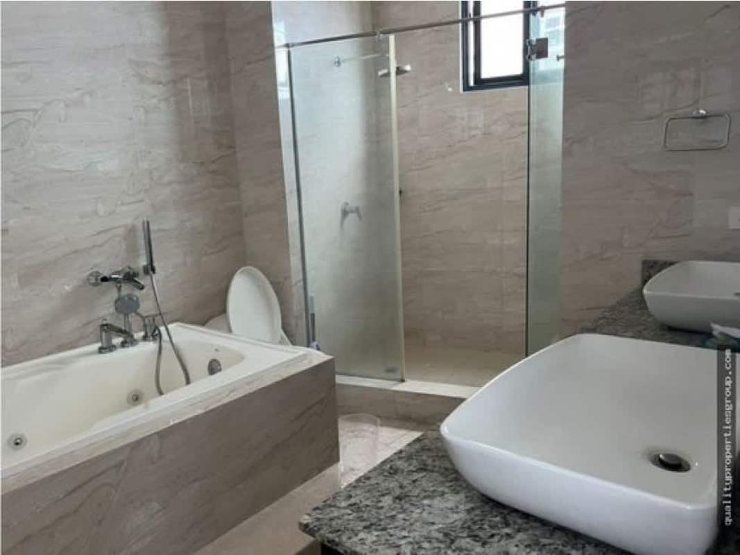 Luxury bathroom with marble tiles, glass shower and jacuzzi tub in Deluxe Residence Panama